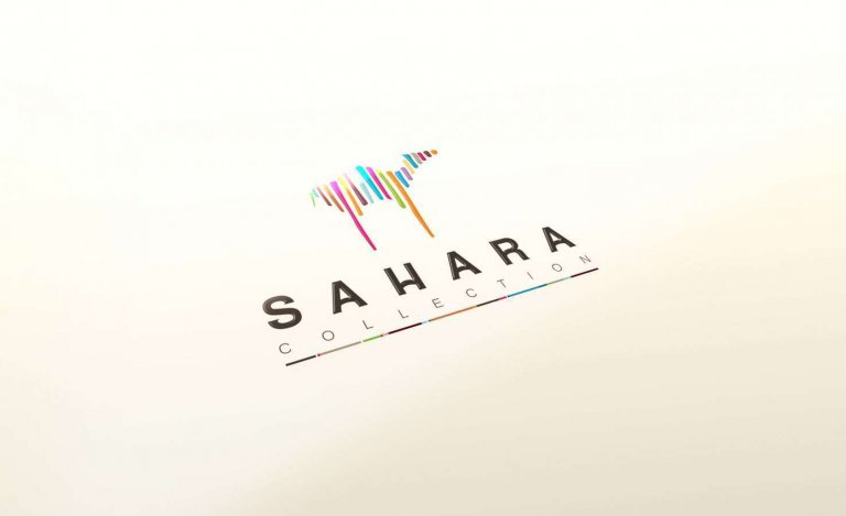 עיצוב לוגו – לוגו SAHARA COLLECTION עם גמל מפסי צבע על נייר לבן בזווית מבט אלכסונית | פורטפוליו מיתוג קרנף סטודיו